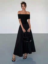 dresses : Elena - Robe Maxi Élégante Épaules Dénudées avec Jupe Plissée in Noir van Seroa