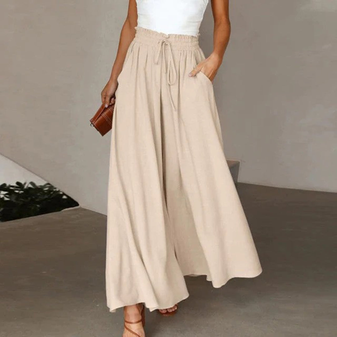 skirts : Jade – Pantalon palazzo ample à jambes larges et taille haute in Beige van Seroa