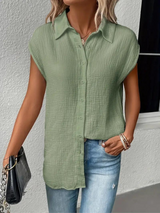 top blouses : Aria – Blouse Décontractée Sans Manches À Boutons Et Nœud Frontal in van Seroa