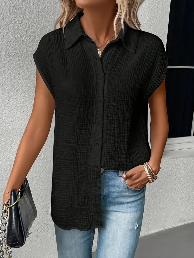 top blouses : Aria – Blouse Décontractée Sans Manches À Boutons Et Nœud Frontal in van Seroa