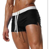 swimwear : Joseph – Short de bain ultra-ajusté, taille basse, à séchage rapide in Noir van Seroa