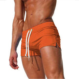 swimwear : Joseph – Short de bain ultra-ajusté, taille basse, à séchage rapide in Orange van Seroa