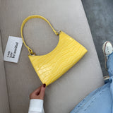 Sacs à main : Slyvia | Sac à main femme en cuir PU élégant et pratique in Jaune van Seroa